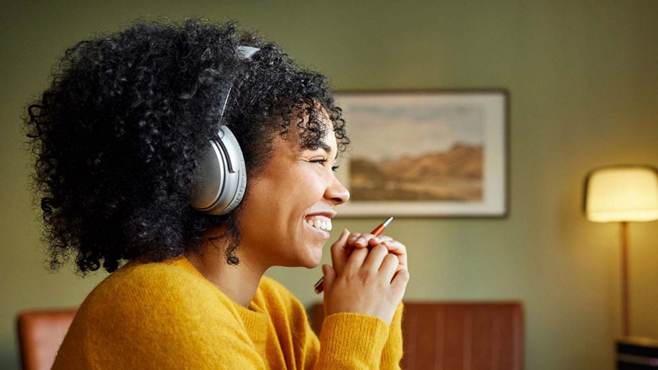Woman with headphones smiling