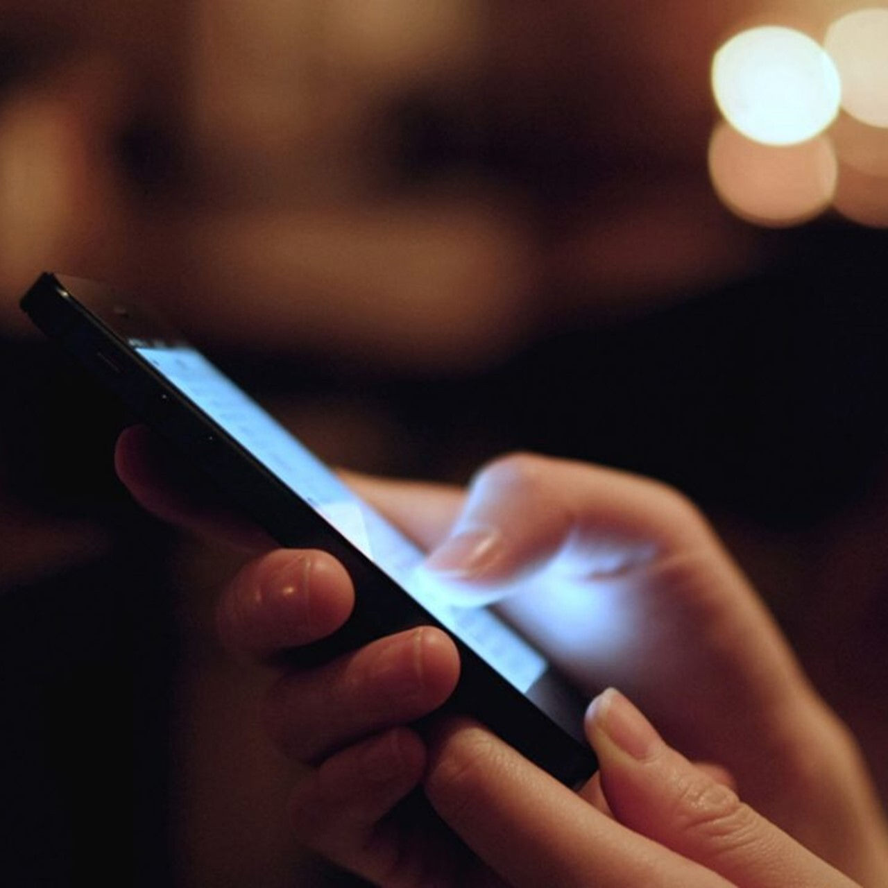Hand touching phone