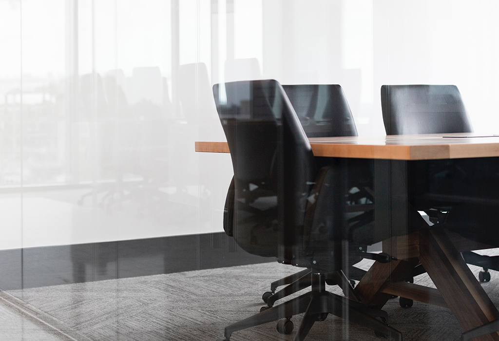 Empty boardroom with table and chairs