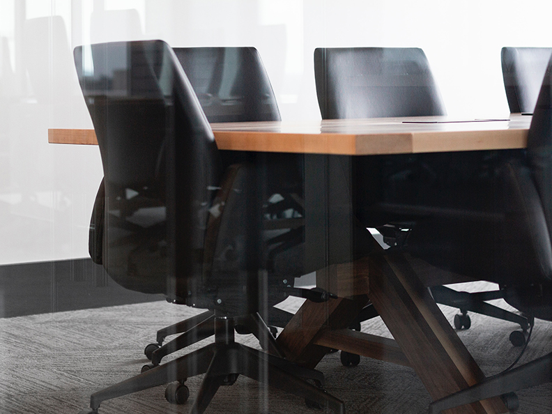 Empty boardroom with table and chairs