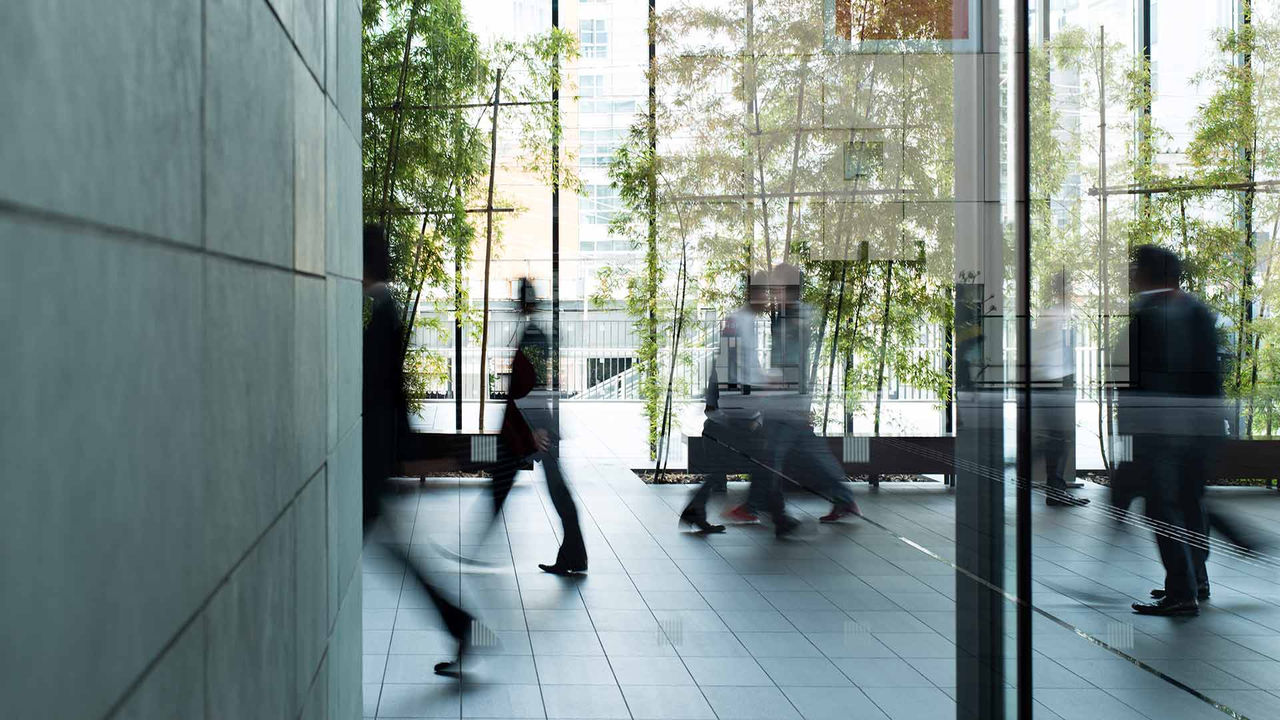 business person walking in a urban building