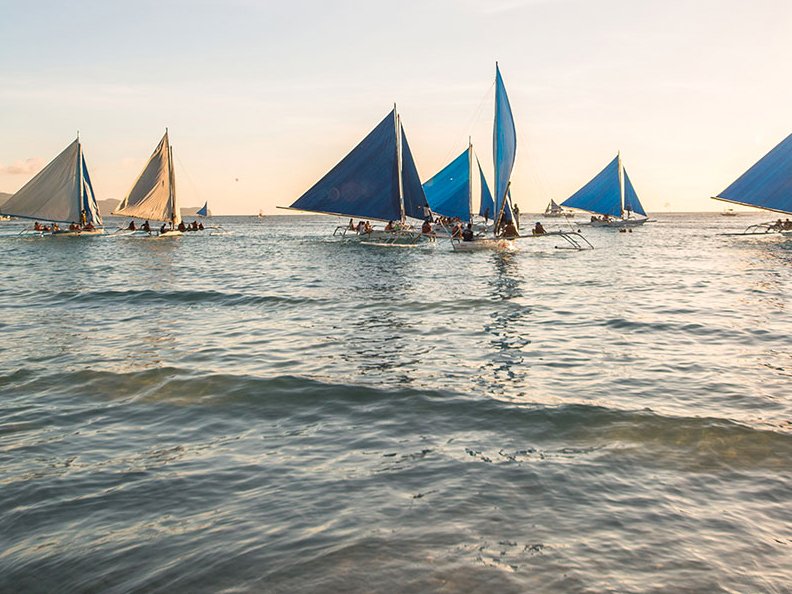 Sailing boats at sunset