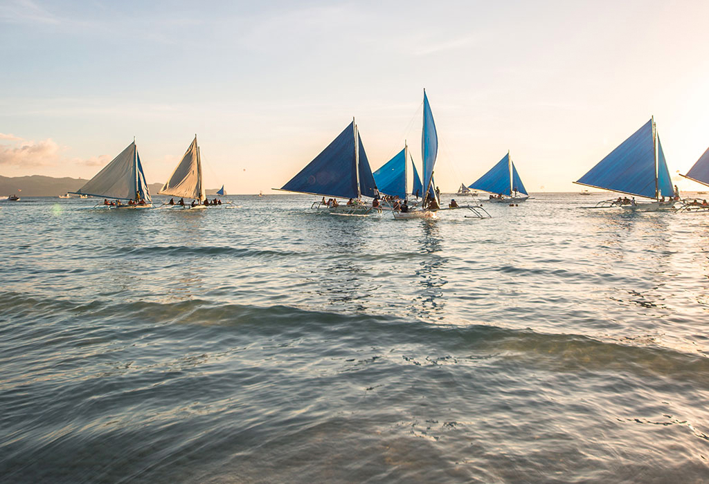 Sailing boats at sunset