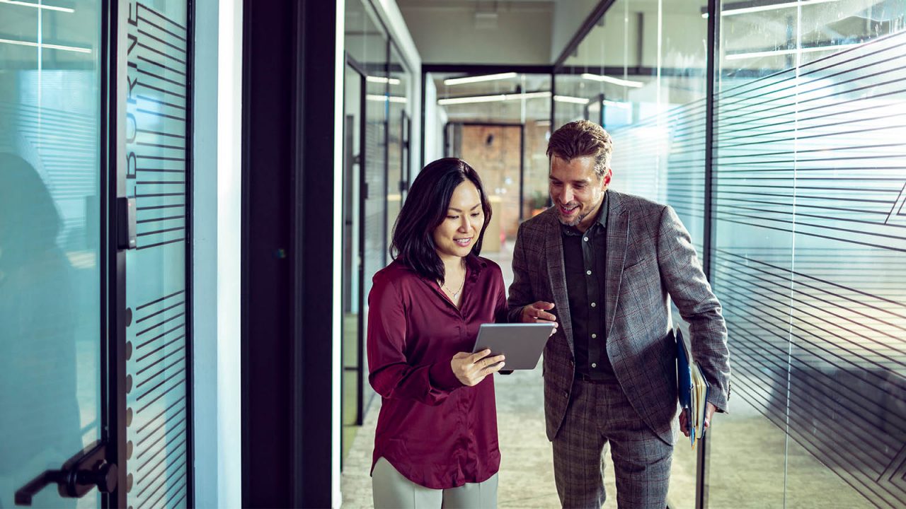 Close up of two business people having a quick chat outside the office