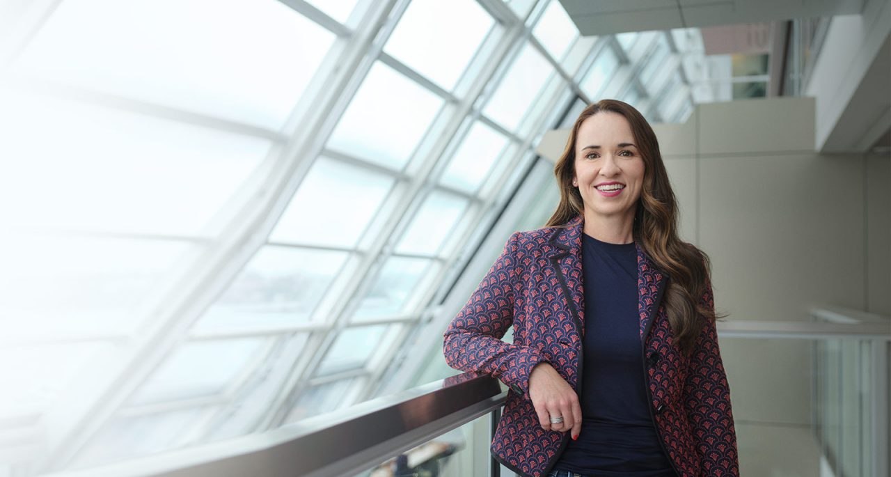 Olivia McArdle standing in office