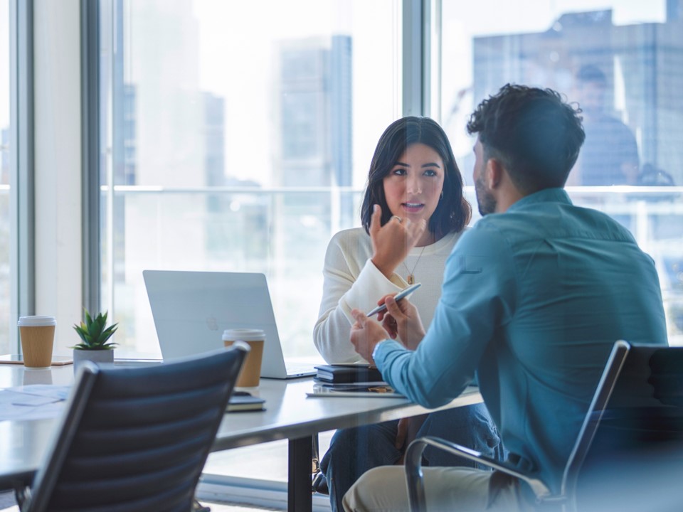 man-and-woman-having-a-discussion-in-an-office