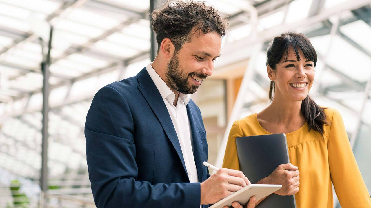 Business man suit woman yellow with tablet