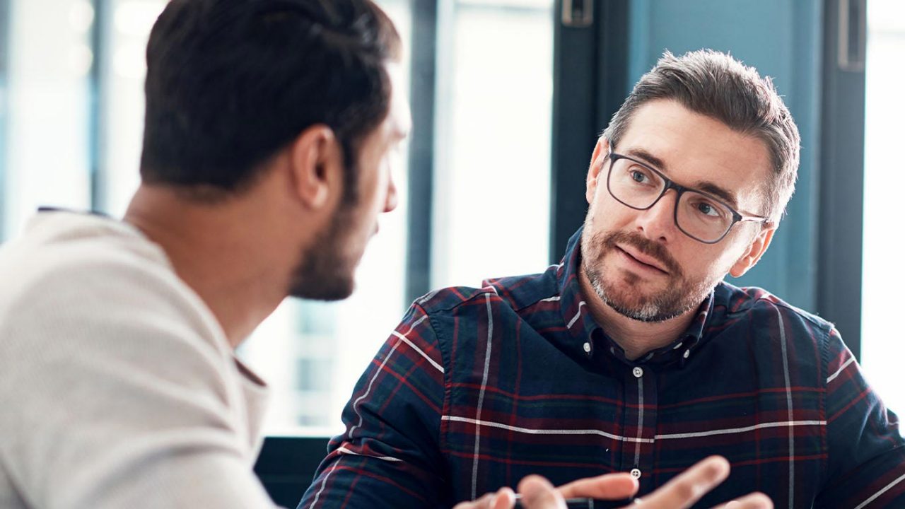 Shot of two businessmen having a discussion in an office