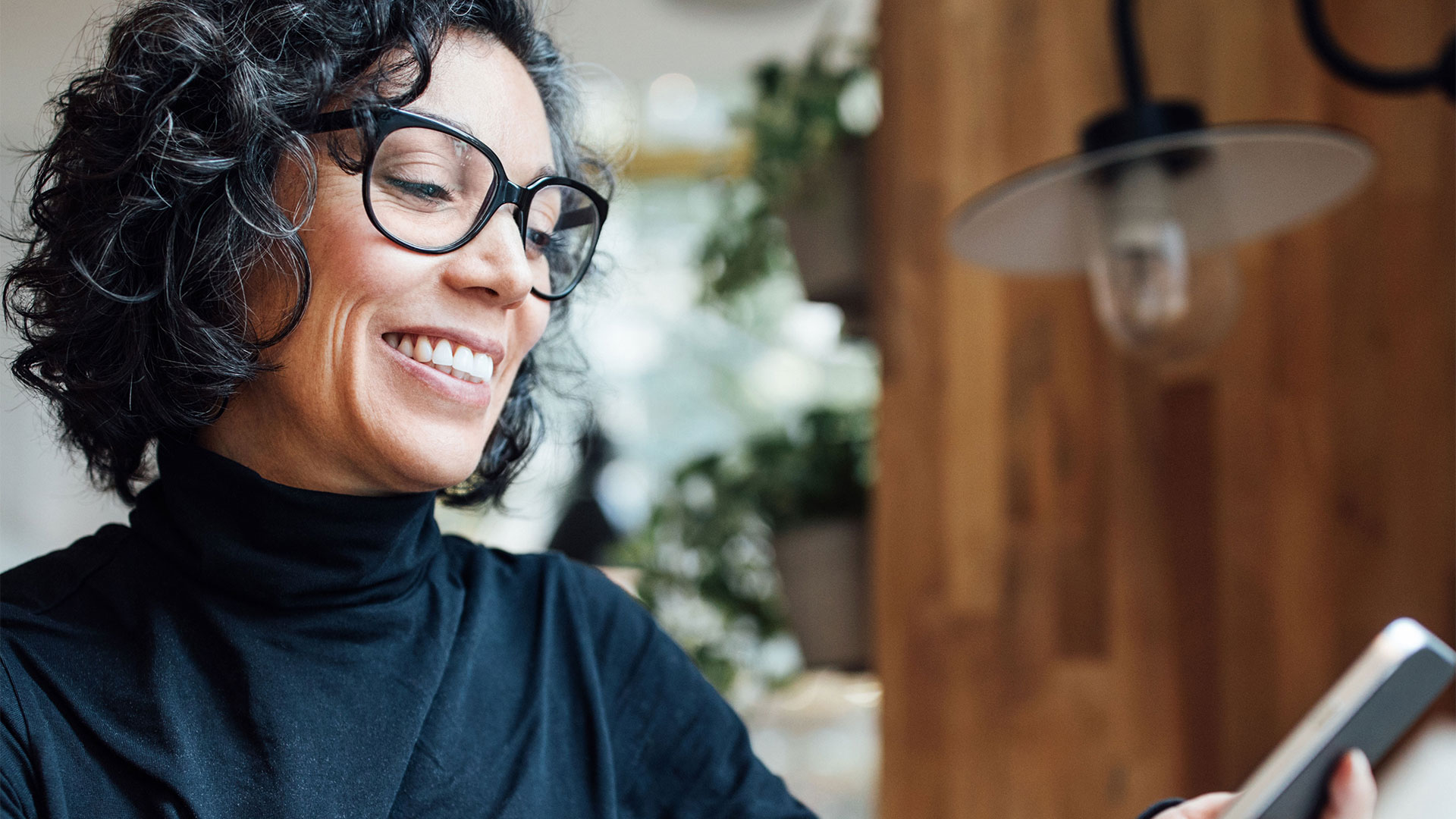 smiling woman using her phone