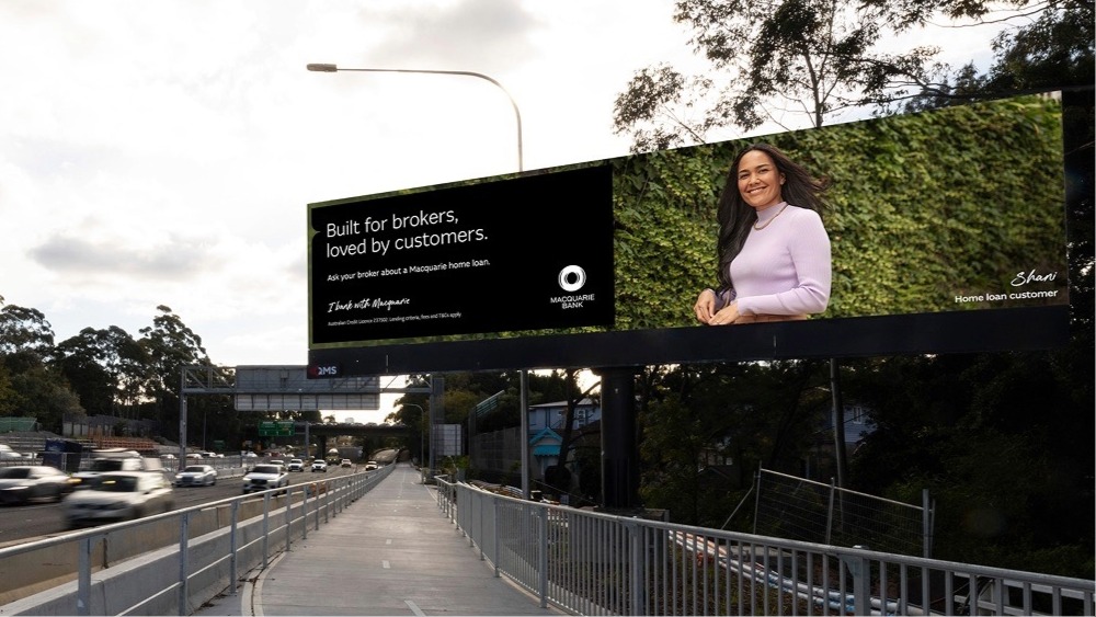 Broker billboard on busy highway