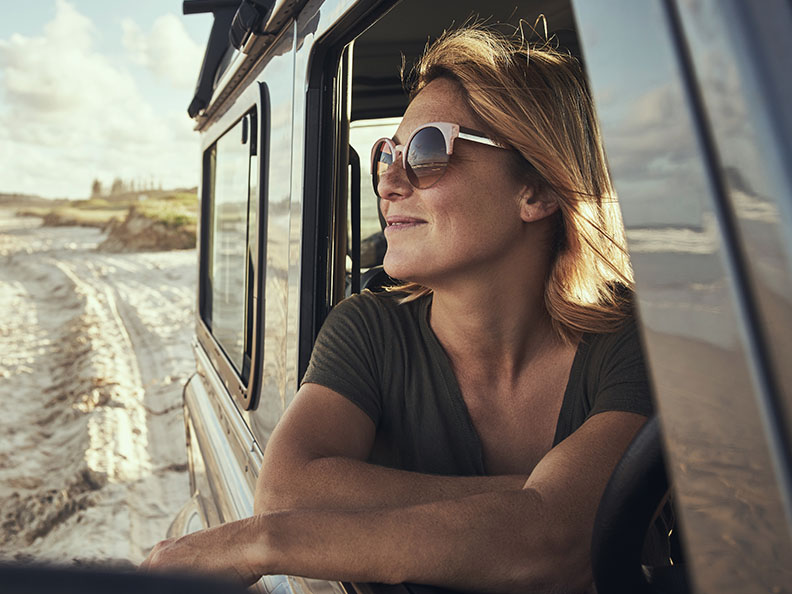 Woman looking out of car window