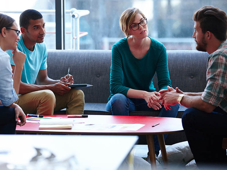 Team of four in discussion