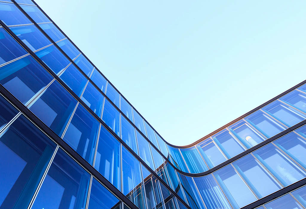 Glass building with blue sky aspect from ground