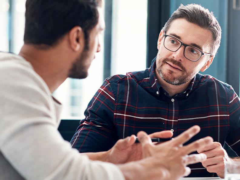 Shot of two businessmen having a discussion in an office