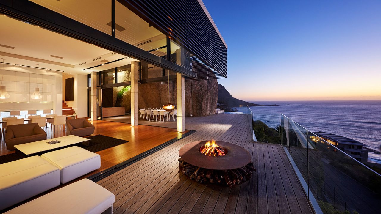 Fire pit on modern luxury home showcase beach house at sunset