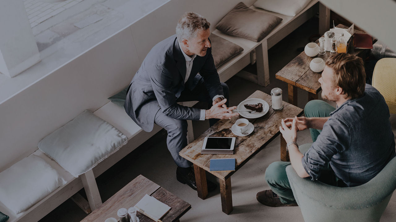Two people meeting in a coffee shop