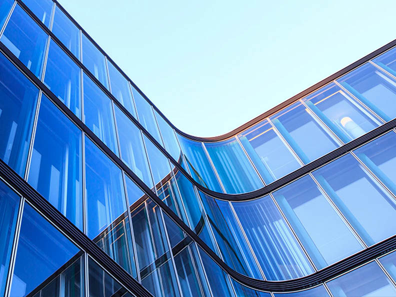 Glass building with blue sky aspect from ground