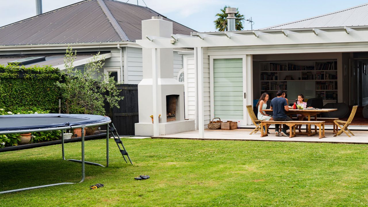 Family sitting outside home