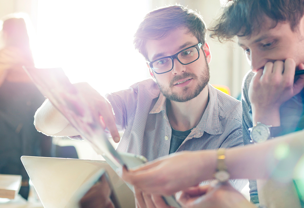 Young coworkers working on project in start-up