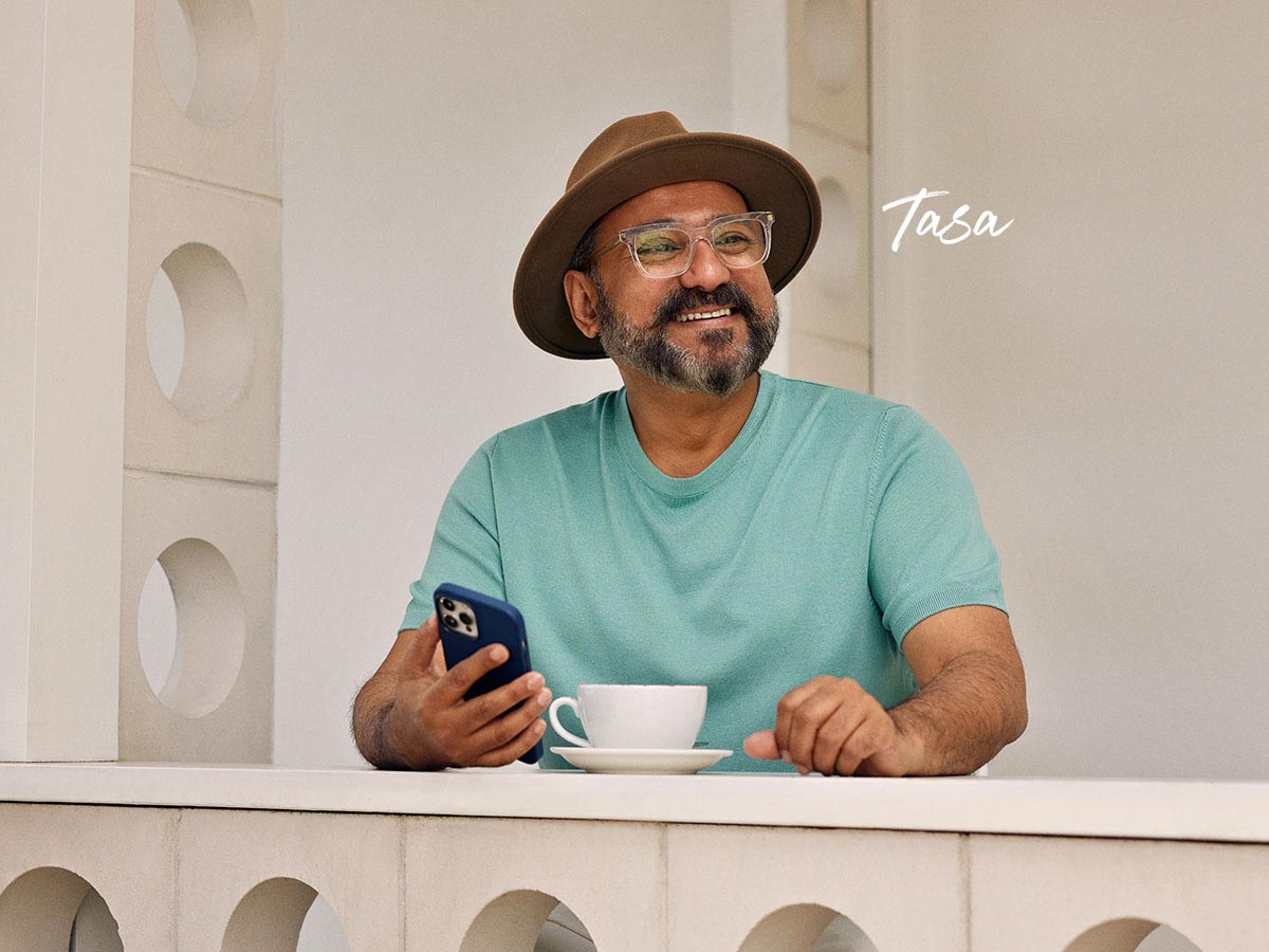 Tasa smiling while holding phone