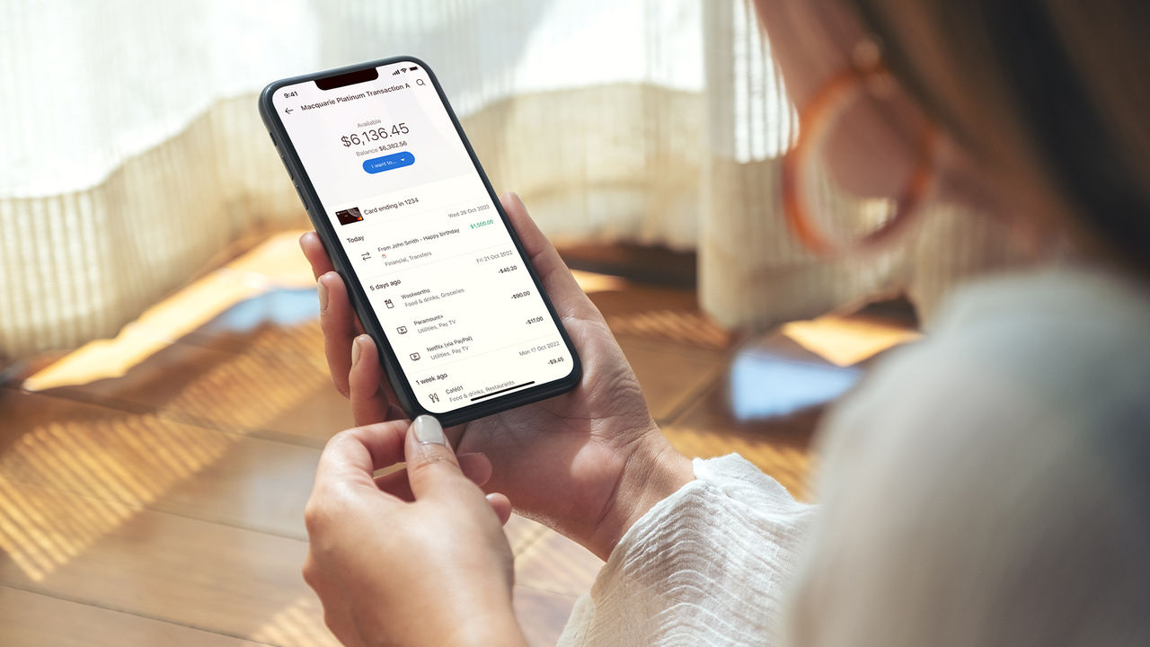 Woman using Macquarie banking app on her phone