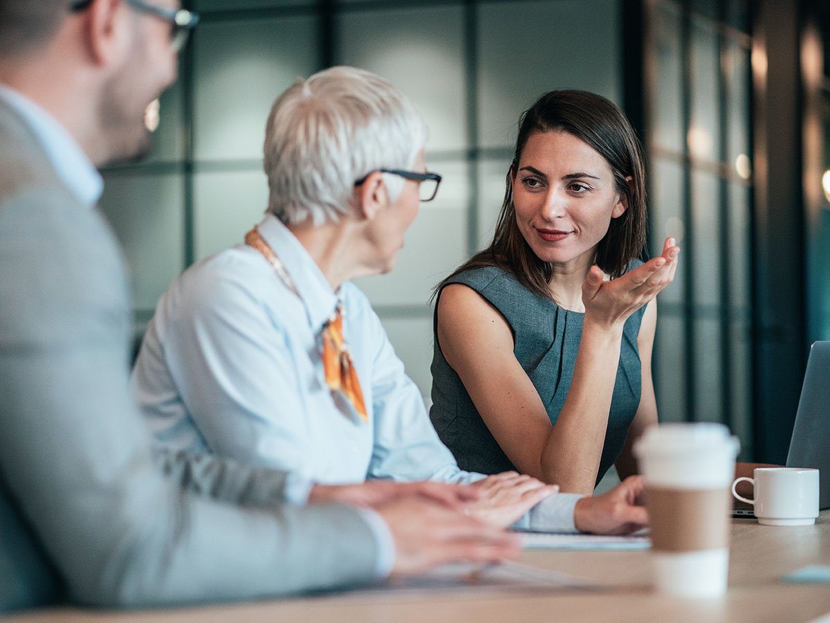 Dedicated support lady consulting with two partners
