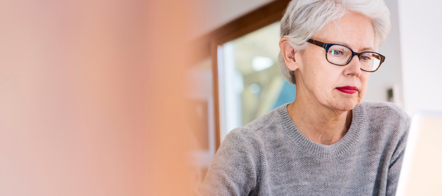 Image of a grey haired woman in glasses