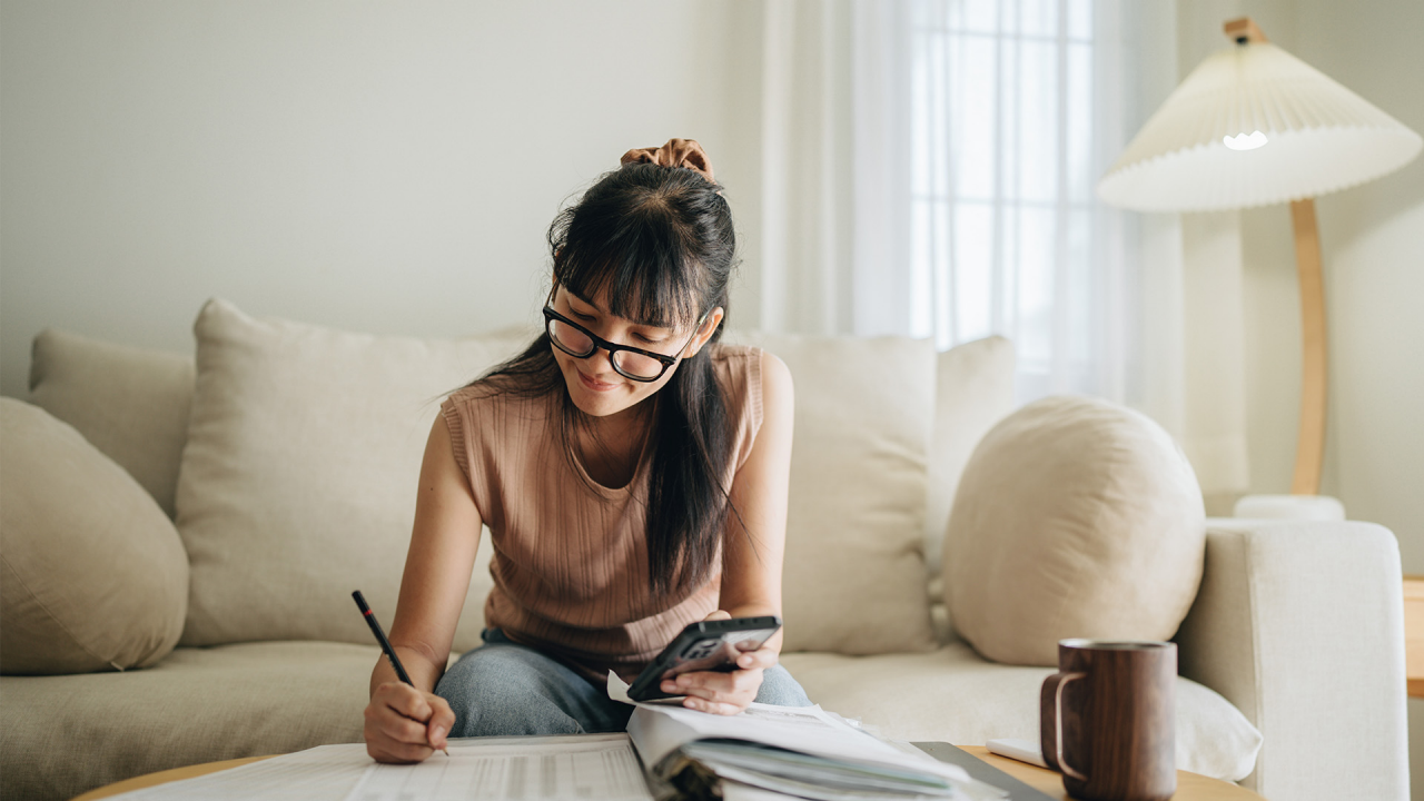 woman sitting and writing