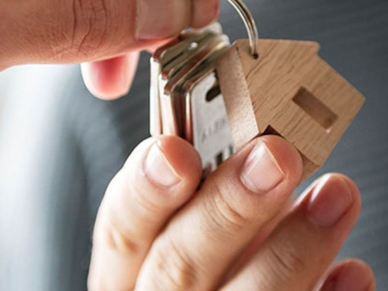 Keys to house with wooden house keyring