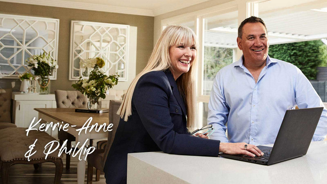 Professional couple work laptop kitchen table