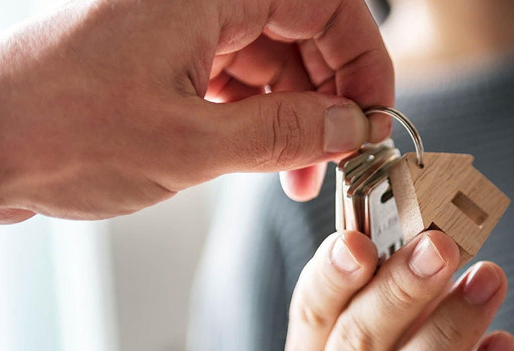 Keys to house with wooden house keyring