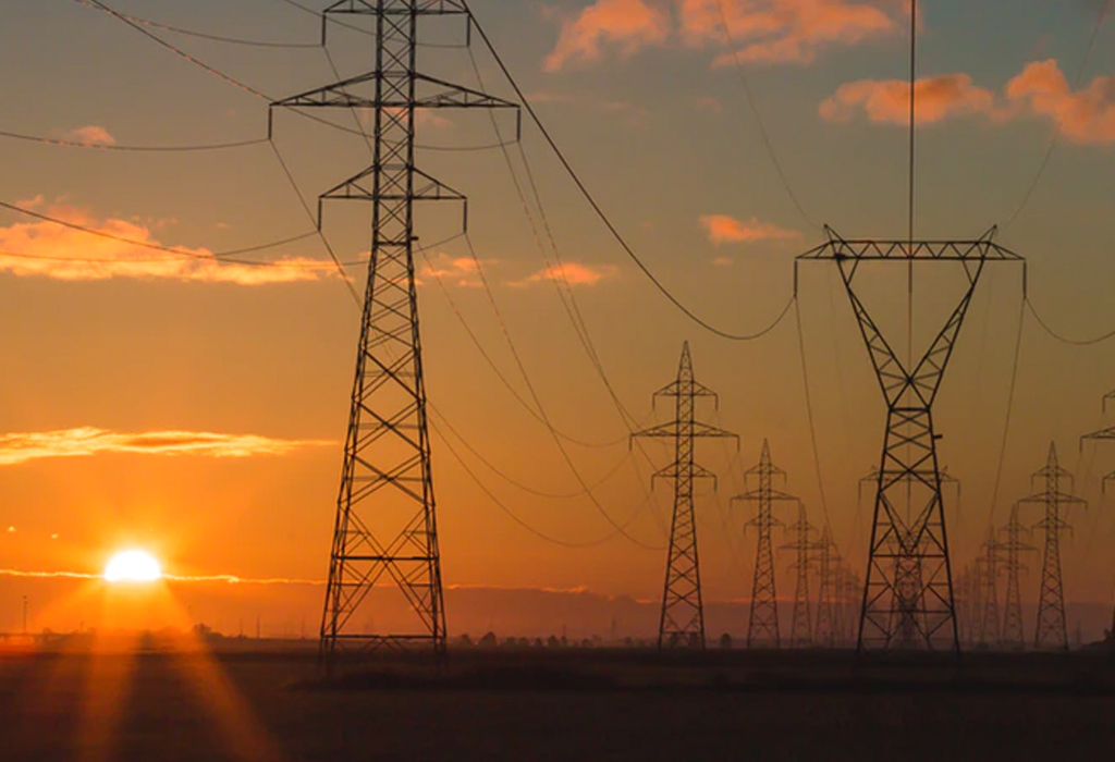 Image of truss towers at sunset