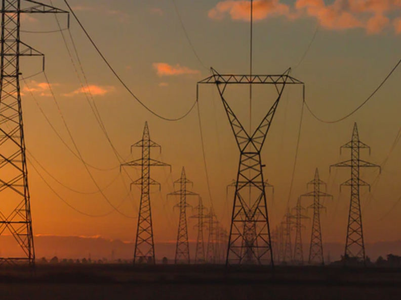 Image of truss towers at sunset