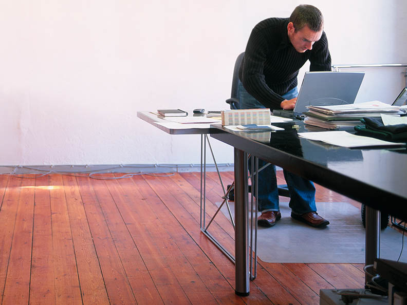 Man working on laptop in stylish office