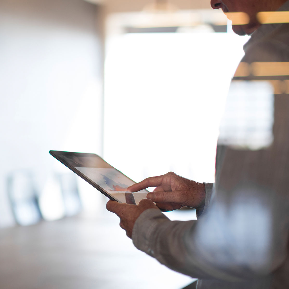 man working on ipad