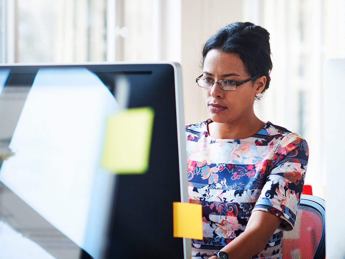 lady in coloured dress working on computer