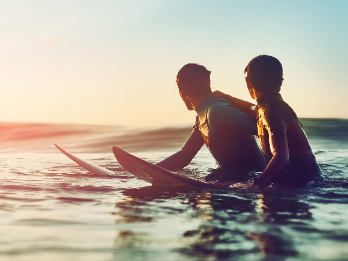 two mates surfing and waiting for a wave
